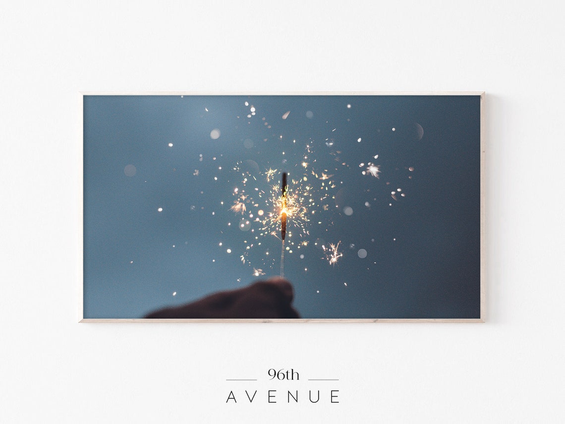 Sparkler Burning Bright Against Deep Blue Night Sky Photo Poster