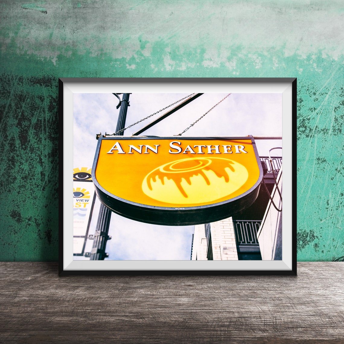 Ann Sather Yellow Hanging Sign with Cinnamon Roll Photography Poster
