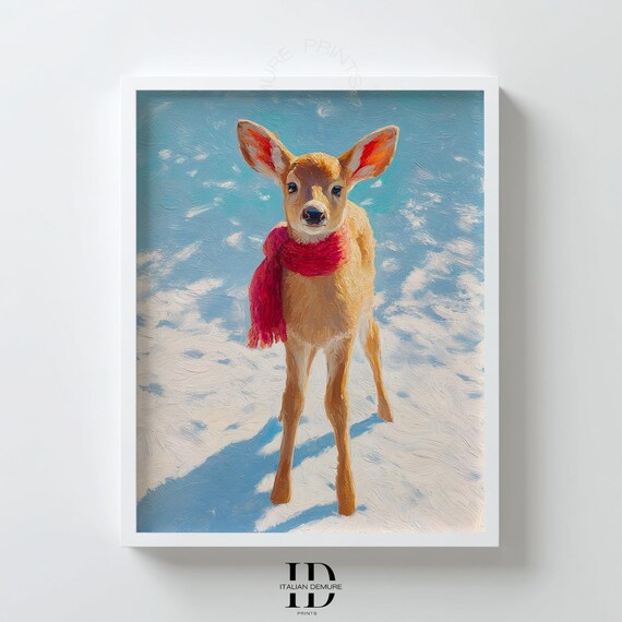 Baby Fawn Wearing a Cozy Red Scarf Standing in Fresh Snow Art Print