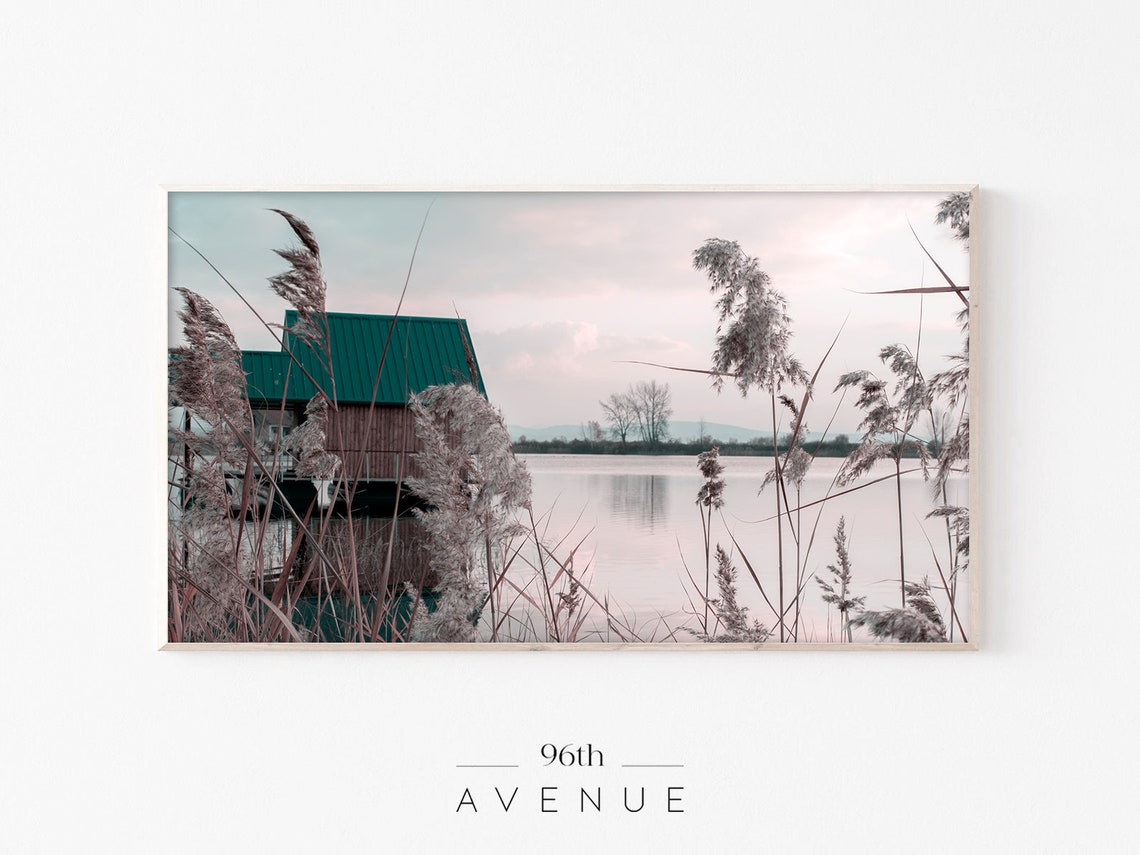 Lakeside Boathouse Green Roof Reeds Under Soft Pink Sky Poster