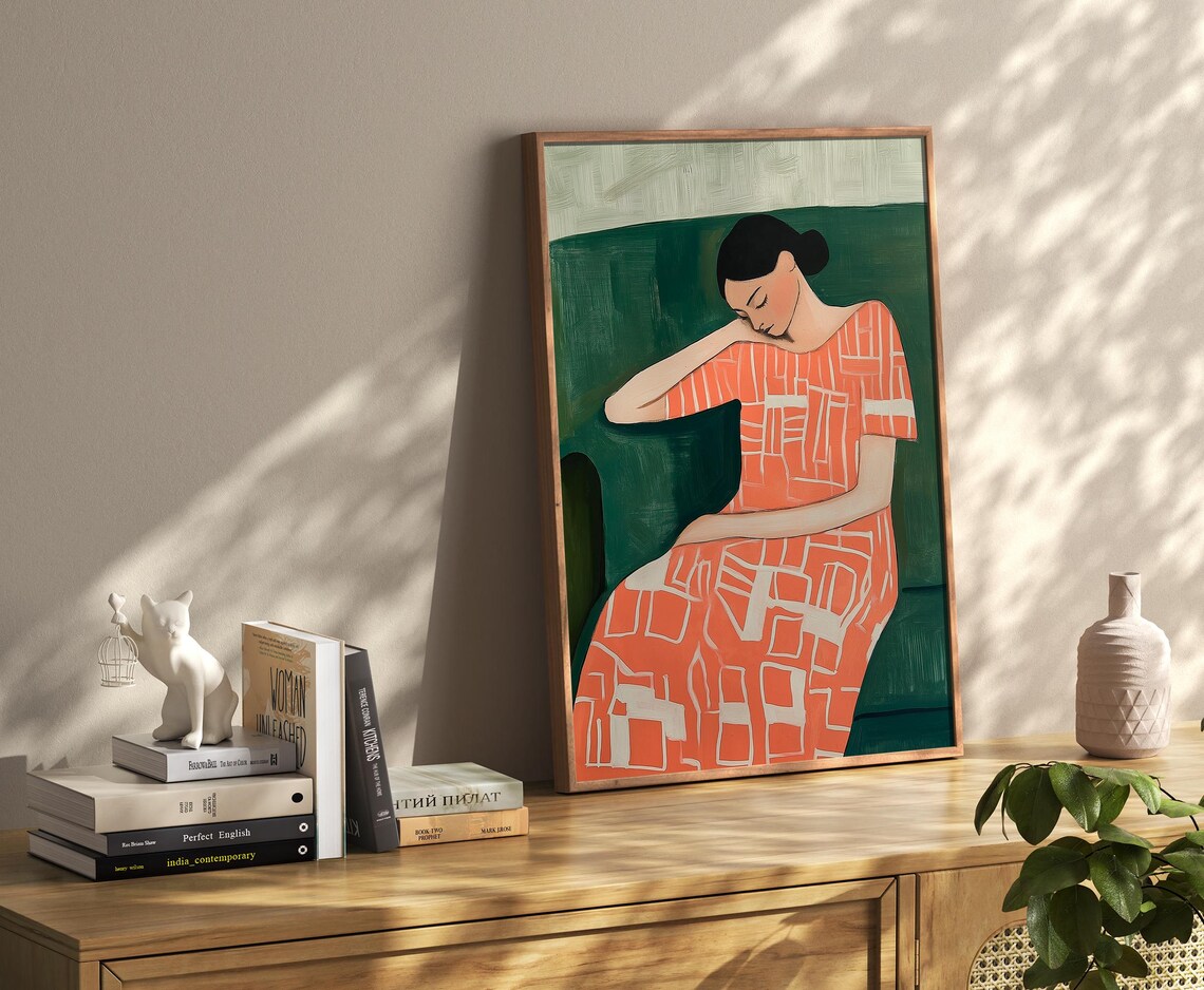 Resting Woman In A Coral Patterned Dress Against Deep Green Wall Art - Image 3