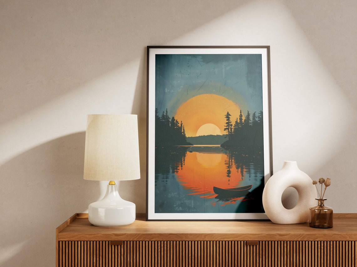 Lone Canoe on Lake Beneath Giant Orange Sunset Landscape Print - Image 2