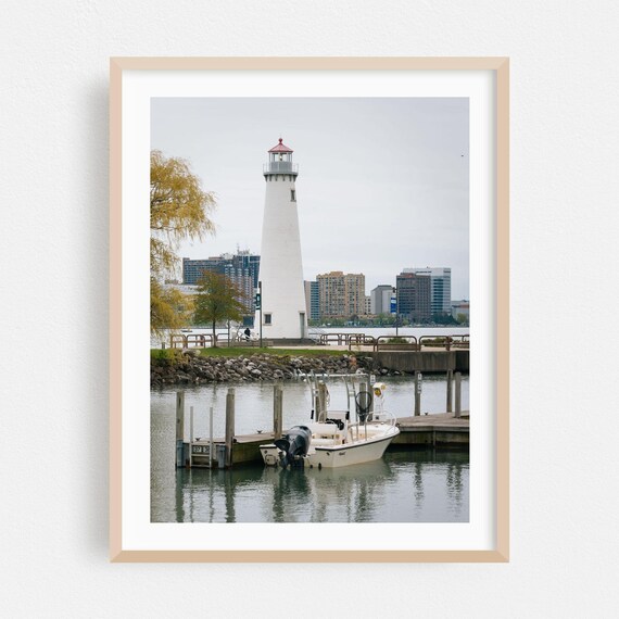 White Harbor Lighthouse With Docked Boat City Skyline Photography Poster