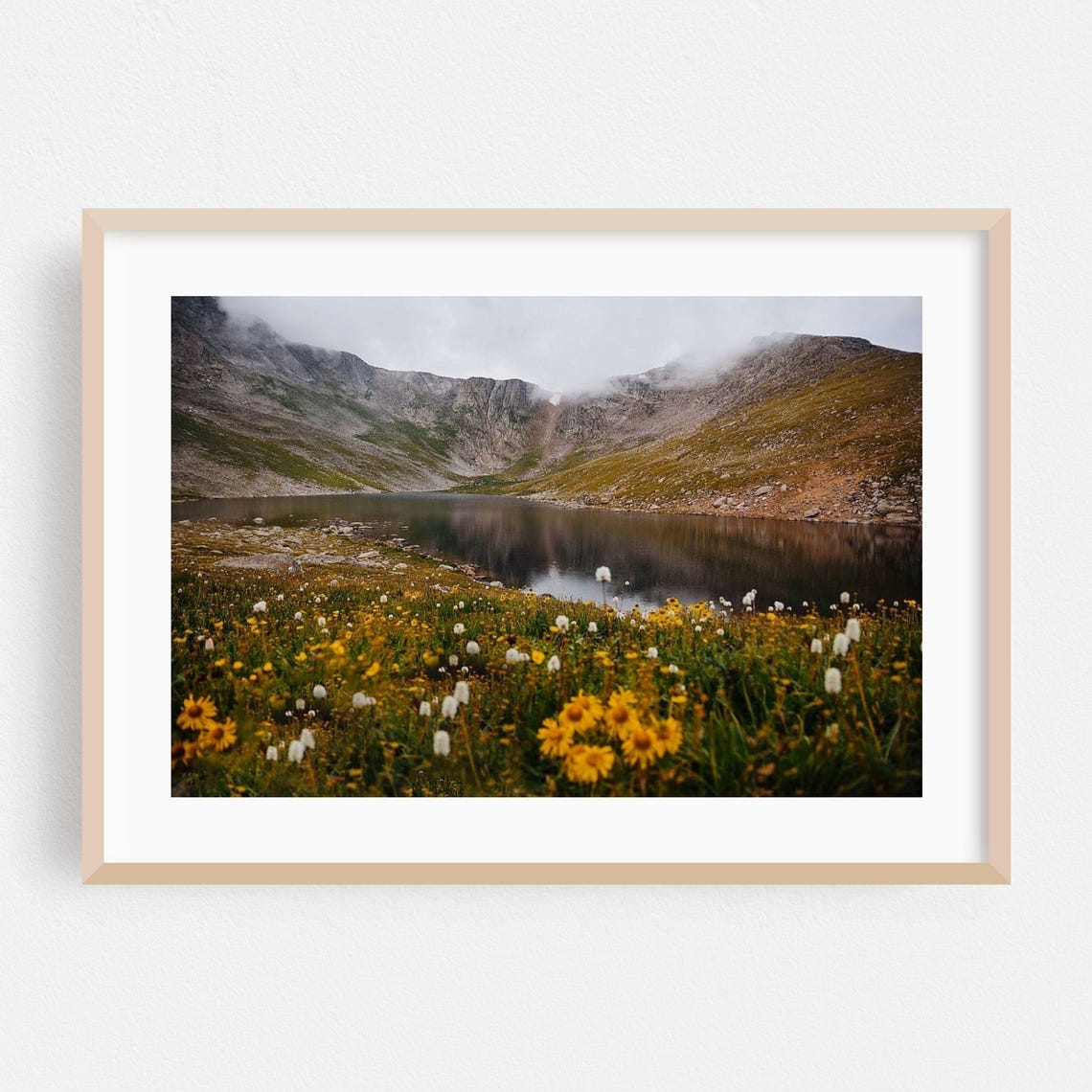 Alpine Lake With Wildflower Meadow Beneath Misty Peaks Poster