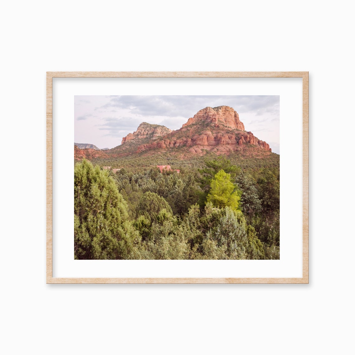 Red Rock Buttes Rising Above Green Pine Forest Valley Poster