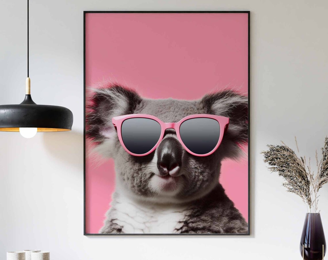 Smiling Koala in Pink Sunglasses Against a Pink Background Poster