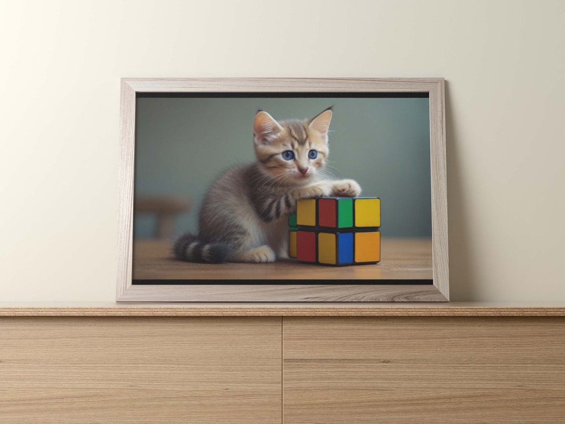 Blue-Eyed Kitten Playing With a Colorful Rubik Cube Toy Poster - Image 2