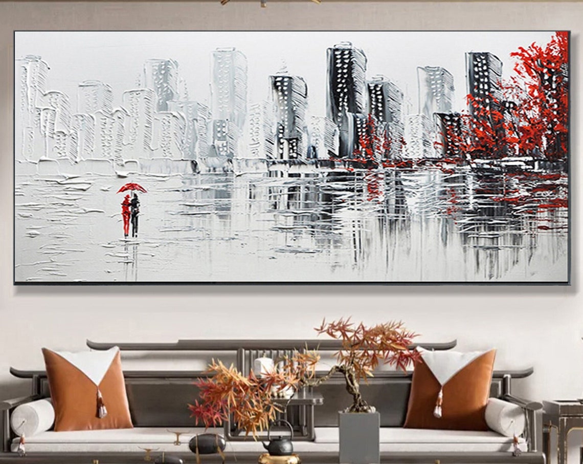 Couple Under Red Umbrella in White Cityscape With Red Trees Poster