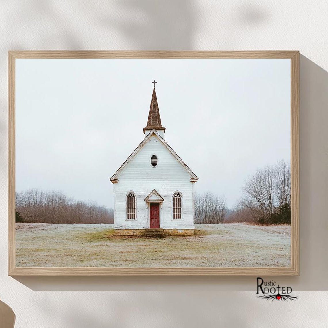 White Country Church with Red Door in a Snowy Field Scene Poster