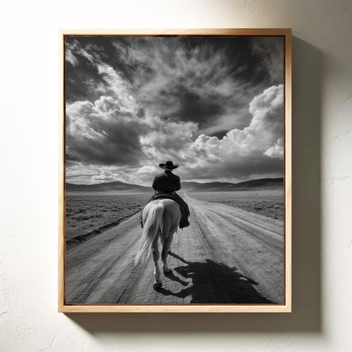 Lone Cowboy Riding Away on Dusty Road Black and White Poster