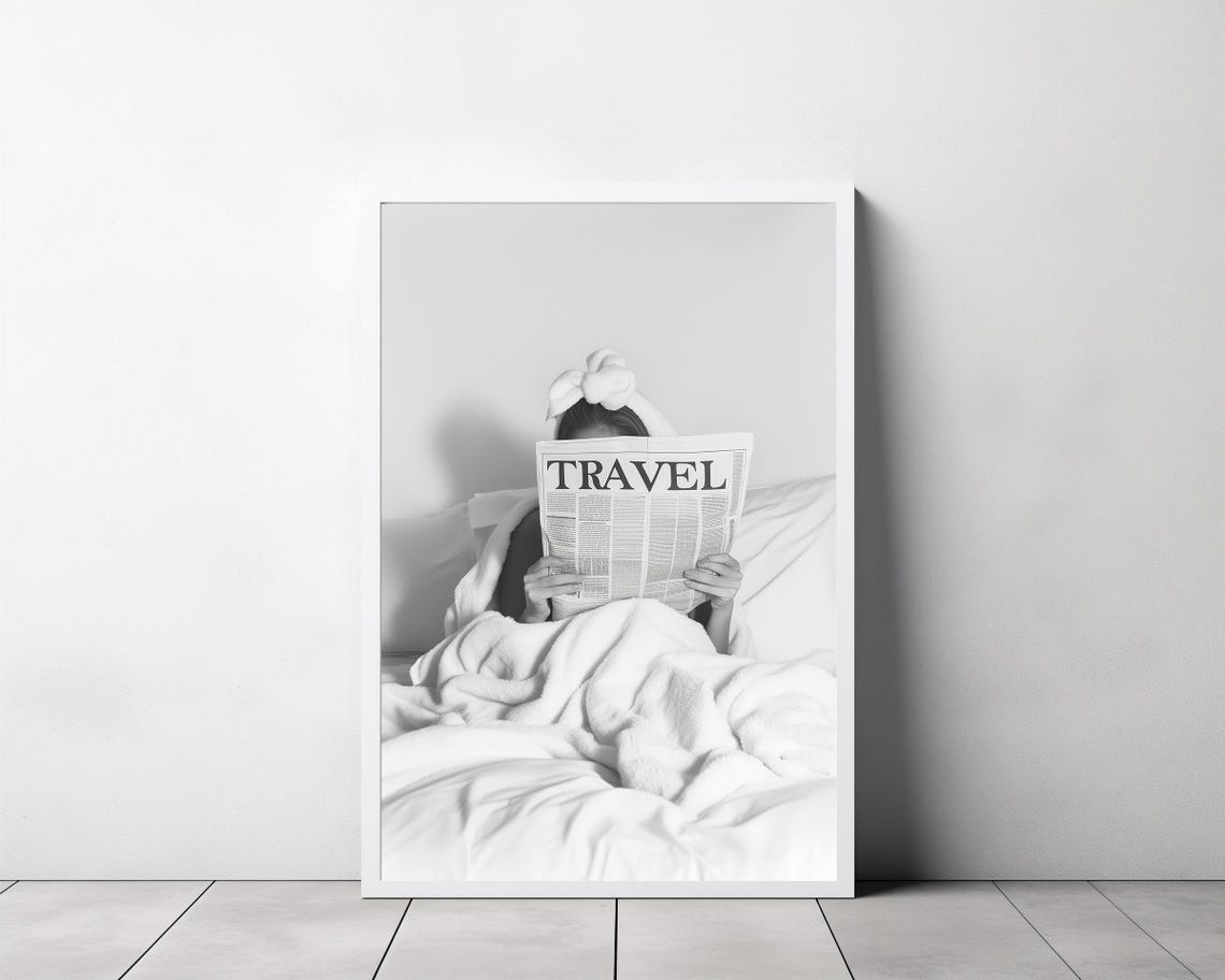 Woman Reading Travel Newspaper in Bed Black and White Poster - Image 3