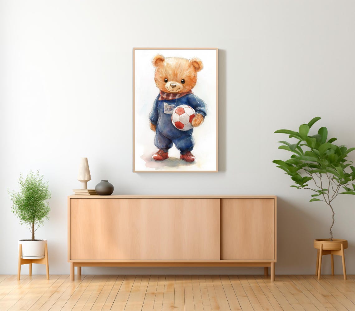 Teddy Bear in Blue Overalls Holding a Red Soccer Ball Poster - Image 2