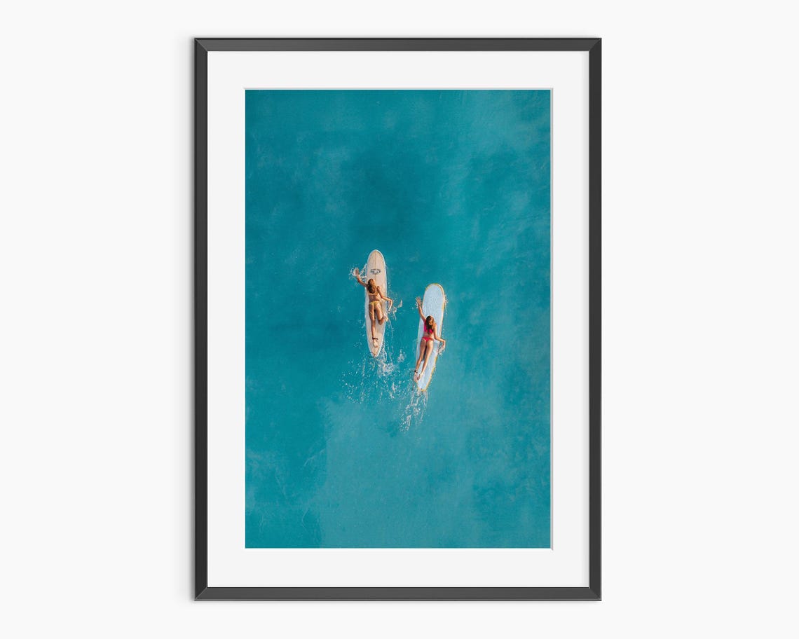 Aerial Drone Shot of Paddleboarders on Turquoise Ocean Poster