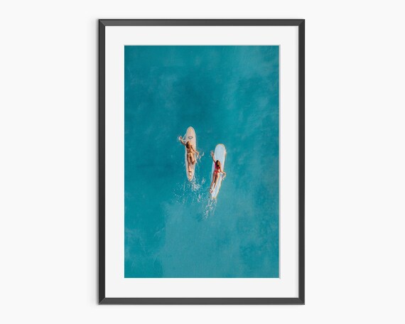 Aerial Drone Shot of Paddleboarders on Turquoise Ocean Poster