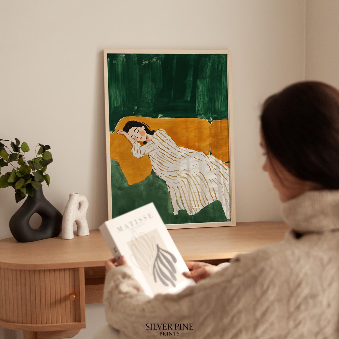 Sleeping Woman on Orange Couch Against Emerald Green Wall Poster - Image 3