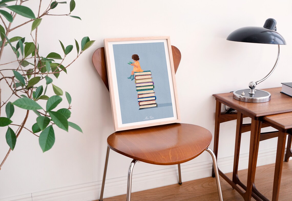 Child Reading Atop a Tall Tower of Colorful Books on Blue Poster - Image 4