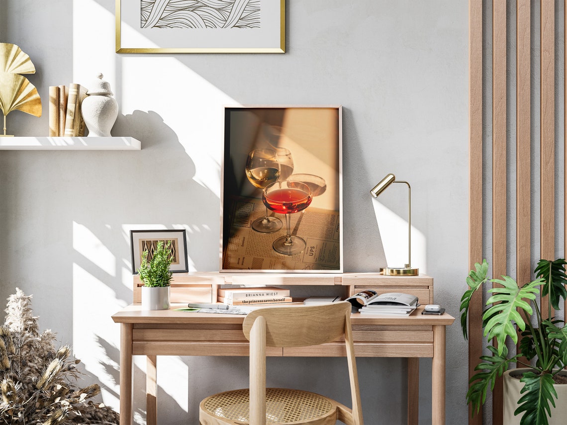 Golden Hour Wine Glasses Poster Layered Over Retro Newspaper Backdrop - Image 4