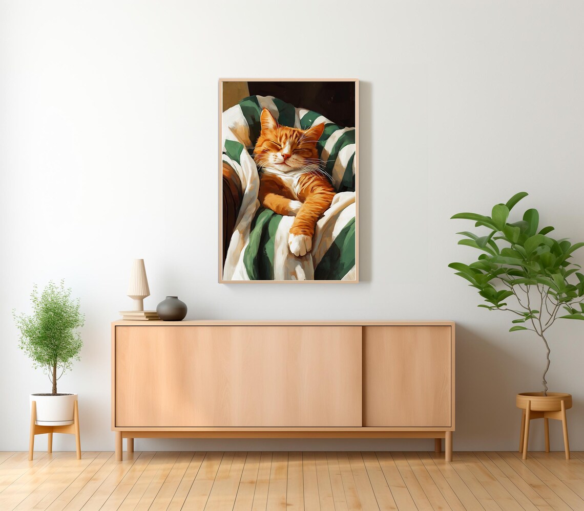 Sleeping Ginger Cat Snuggled in a Green and White Striped Blanket Poster - Image 2
