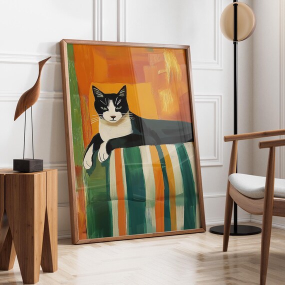 Tuxedo Cat Resting On A Striped Blanket With Warm Orange Wall Art