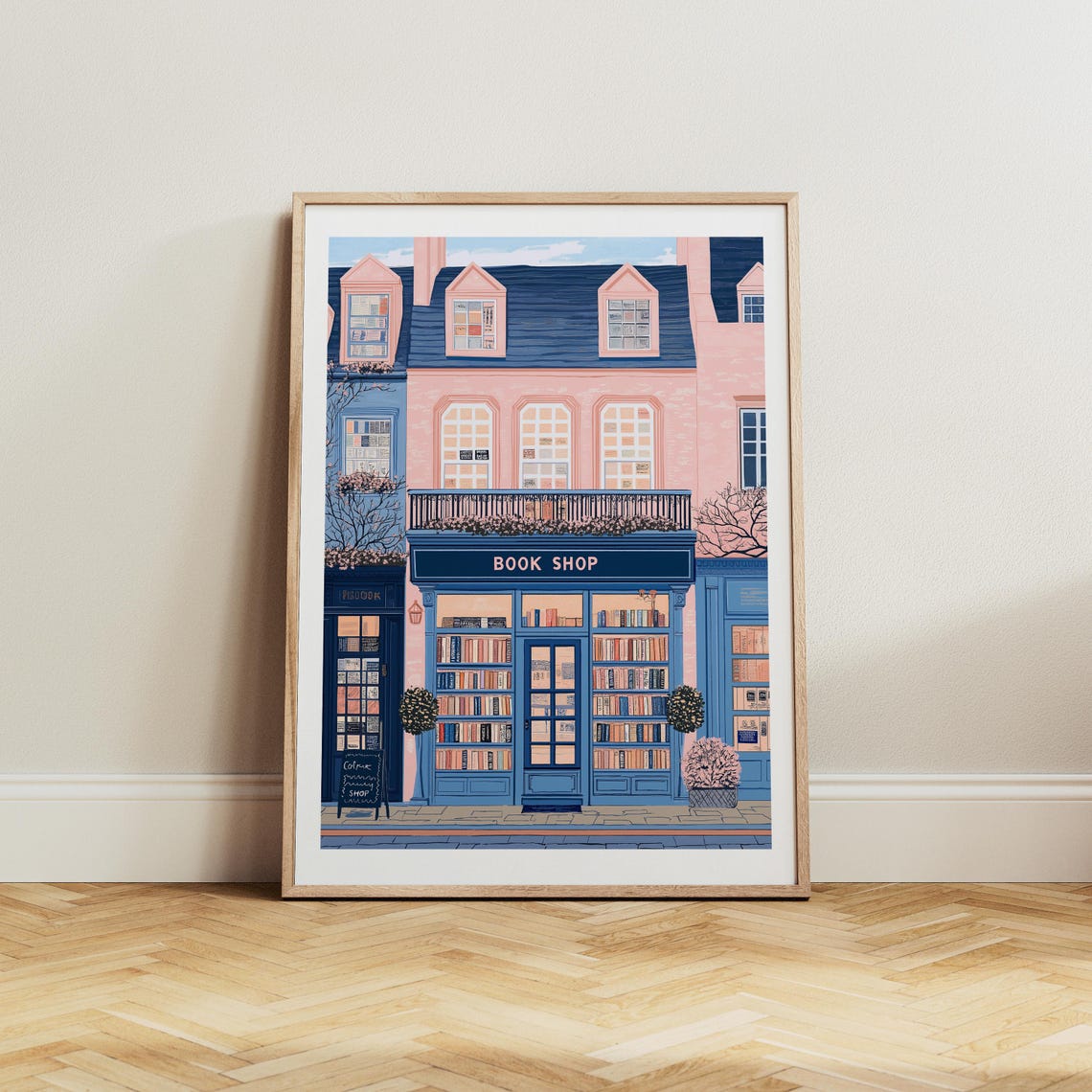 Navy Book Shop Storefront With Parisian Pink Building Above Poster - Image 4
