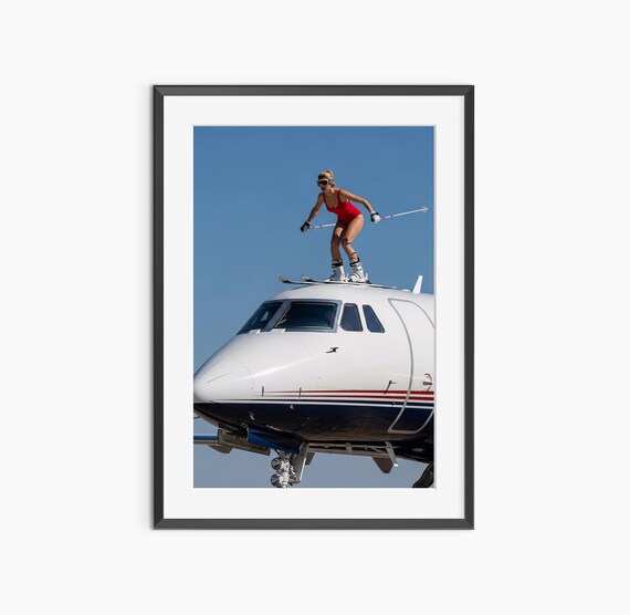 Skier Woman in Red Swimsuit Standing on Private Jet Photography Poster