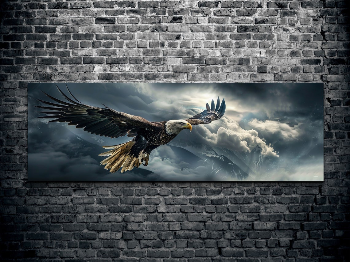 Majestic Bald Eagle Soaring Over Storm Clouds and Mountains Poster - Image 2
