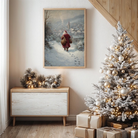 Santa Walking Down Snowy Hill Toward Village Art Print