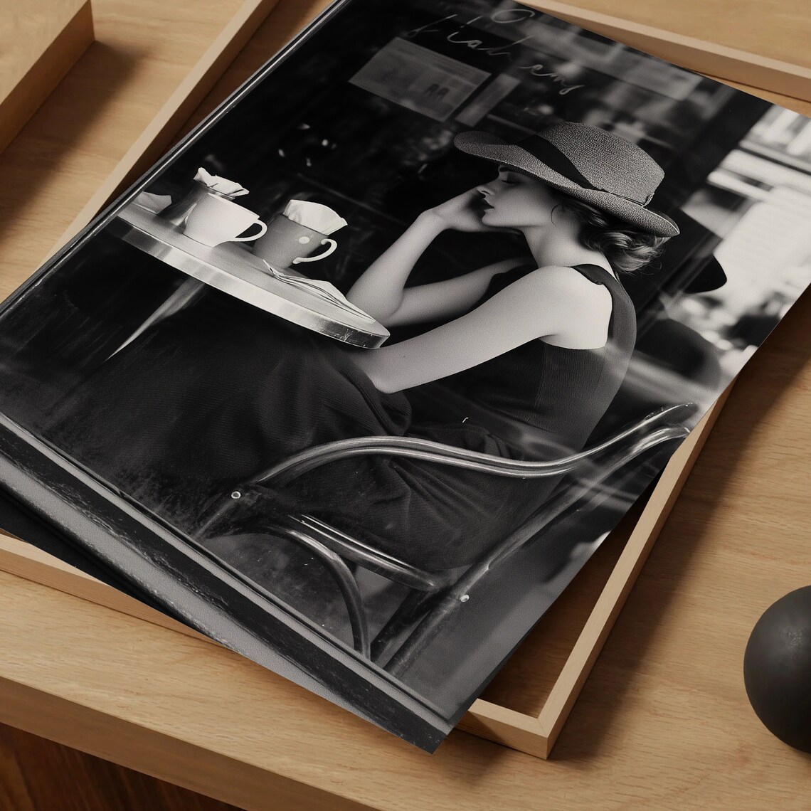 Black and White Photo Woman in Hat at French Cafe Table Poster - Image 4