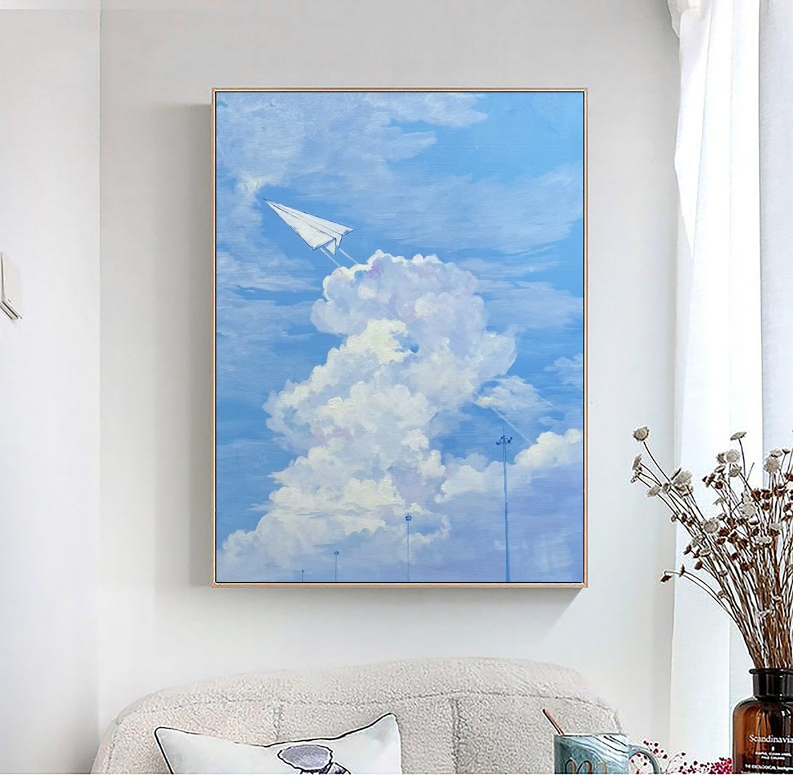 Paper Airplane Soaring Through Blue Sky with White Clouds Art Poster - Image 4