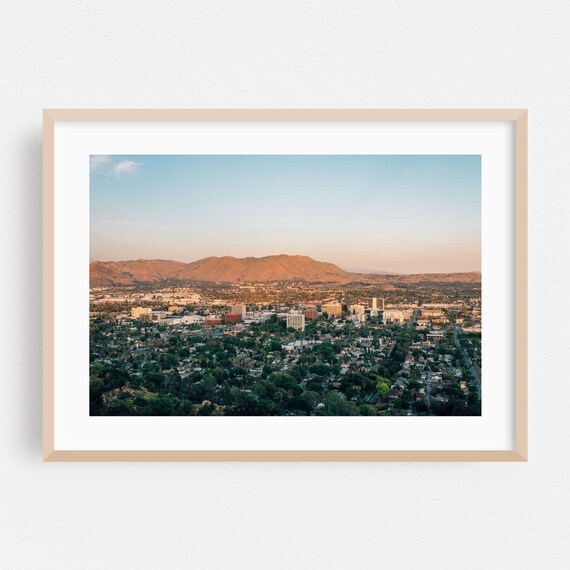 City Skyline At Golden Hour With Mountain Backdrop Sunset Poster