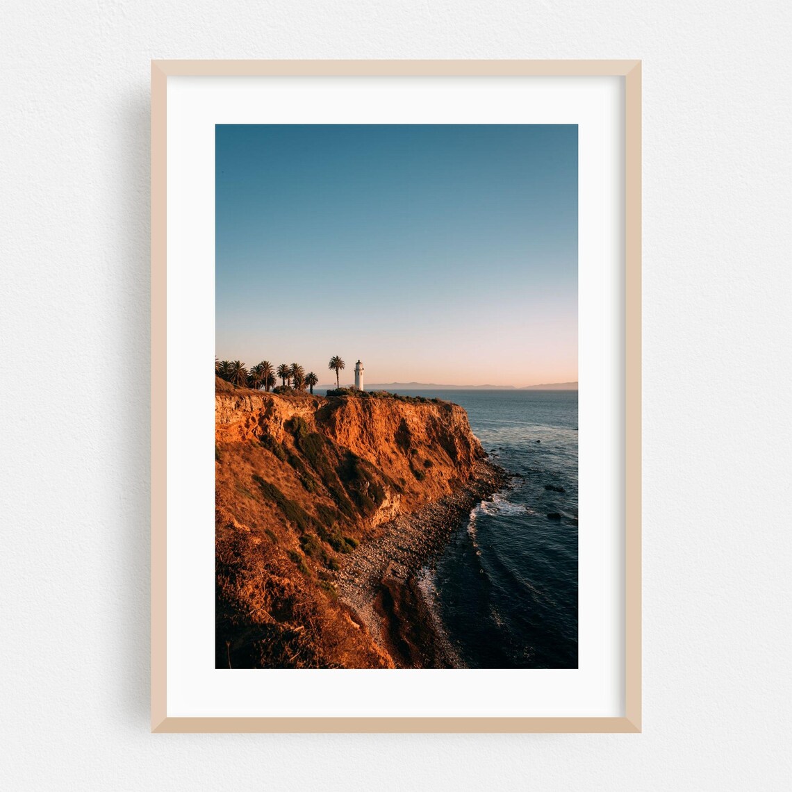 Coastal Lighthouse at Sunset Over Palm-Topped Cliffs Photography Poster