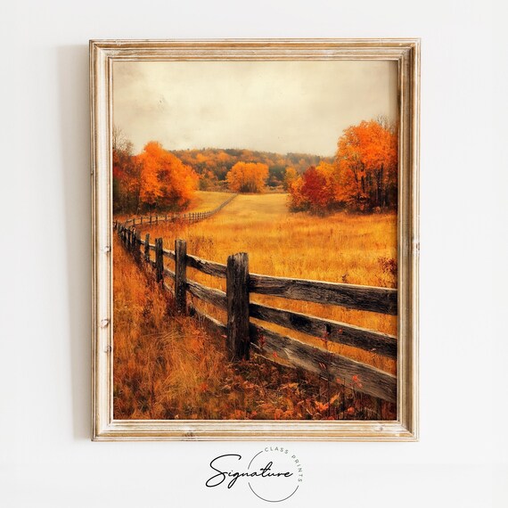 Wooden Fence Leading Through Golden Meadow to Autumn Trees Poster