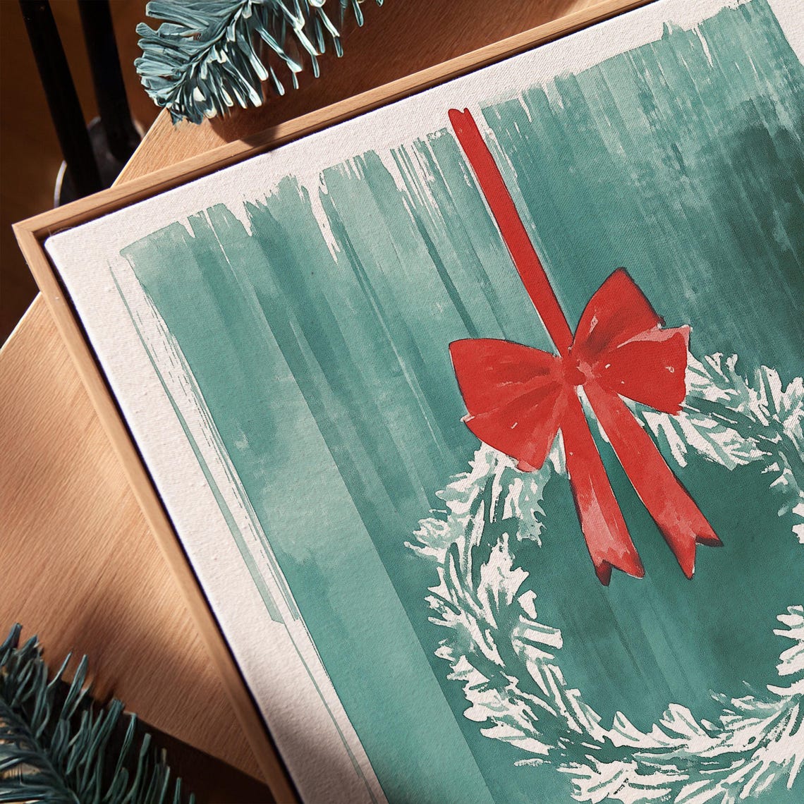 White Snowy Christmas Wreath With a Red Bow on Teal Watercolor Poster - Image 3