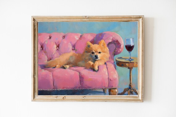 Pomeranian Dog on Pink Velvet Sofa With Red Wine Glass Poster