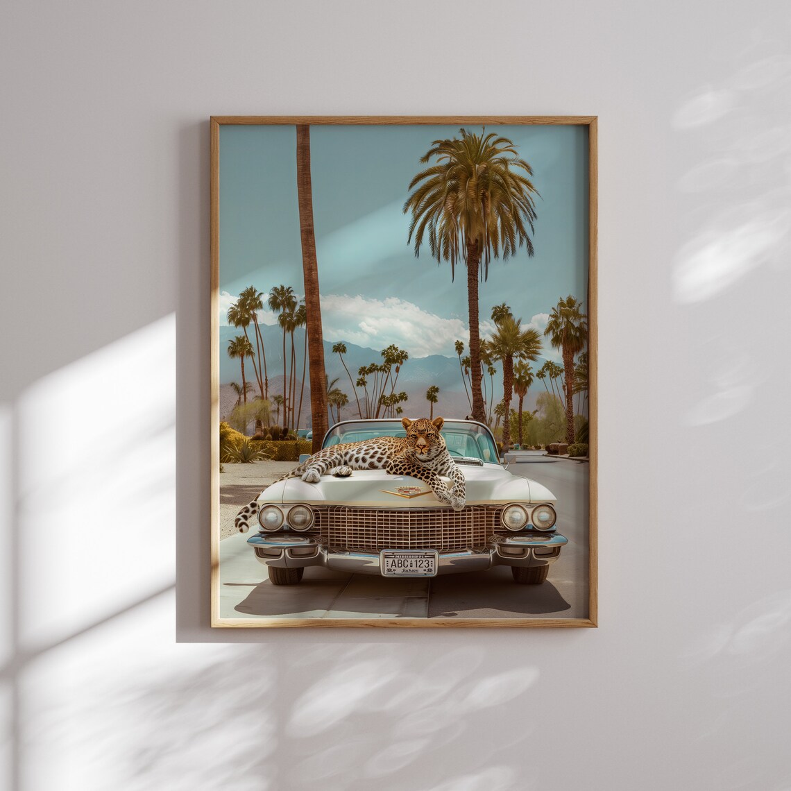 Playful Leopard Stretched Across a Vintage Cream Cadillac Hood Poster - Image 2