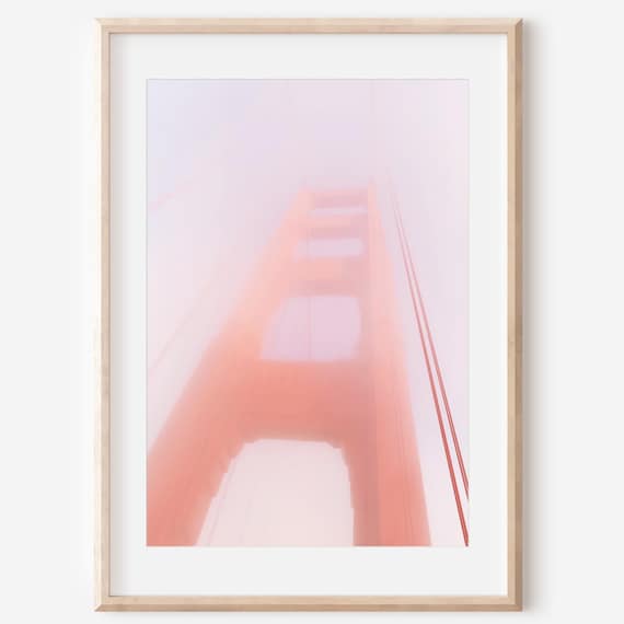 Golden Gate Bridge Tower Wrapped in Soft Pink Morning Fog Poster