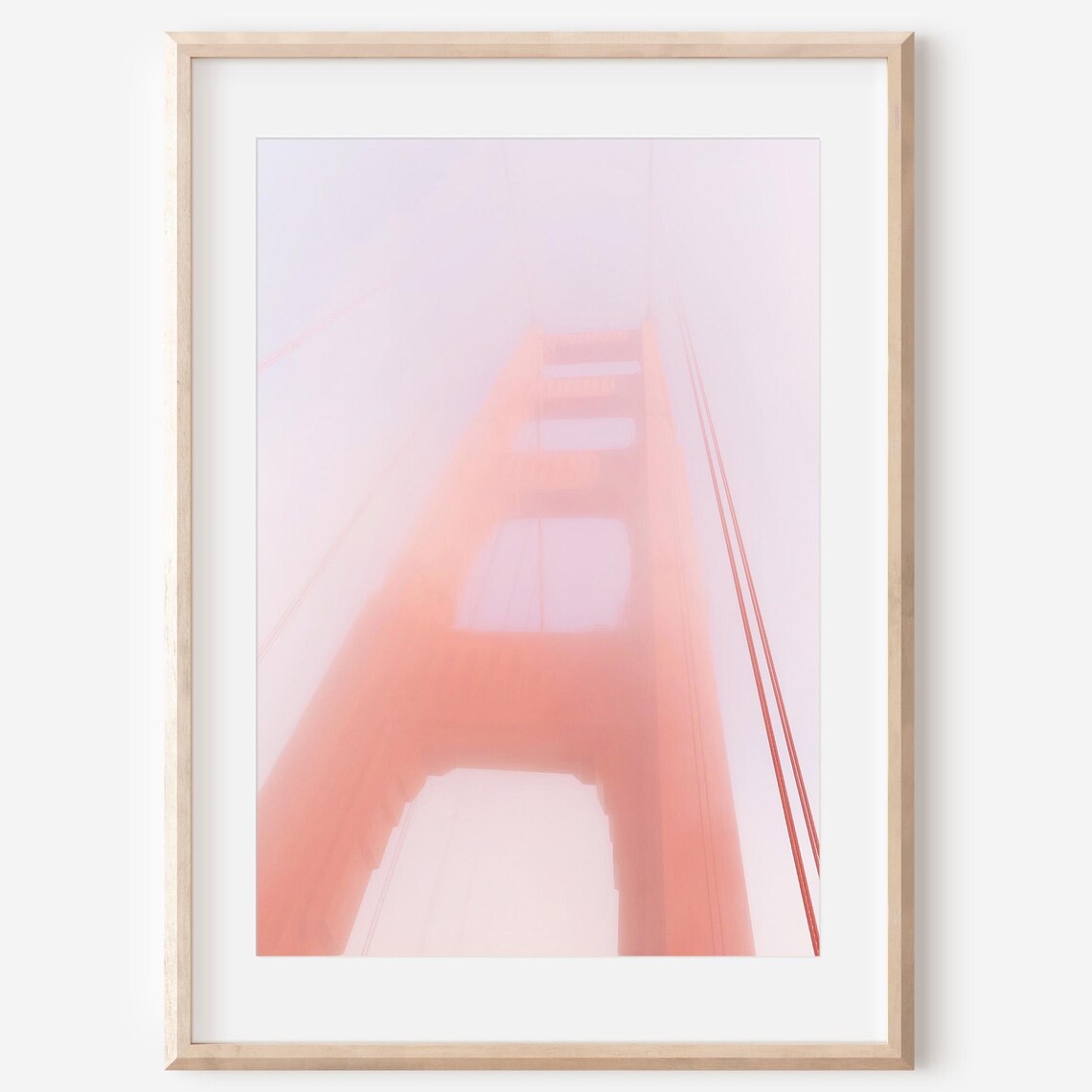 Golden Gate Bridge Tower Wrapped in Soft Pink Morning Fog Poster