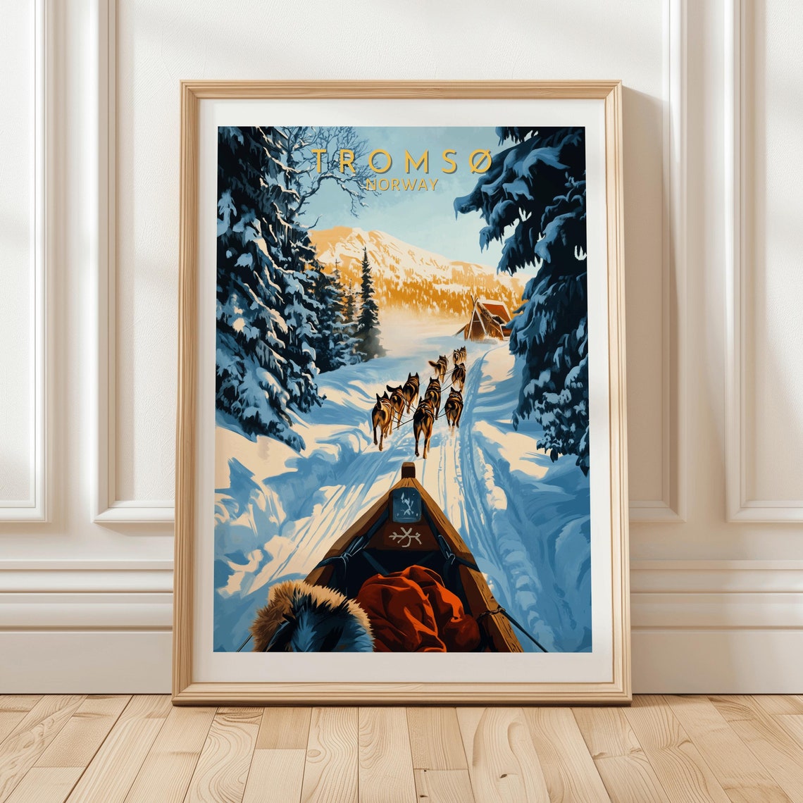 Troms Norway Dog Sledding Winter Print Featuring Huskies Pulling Sled Through Snowy Forest Trail Toward Cozy Cabin Scene Adventure Gift