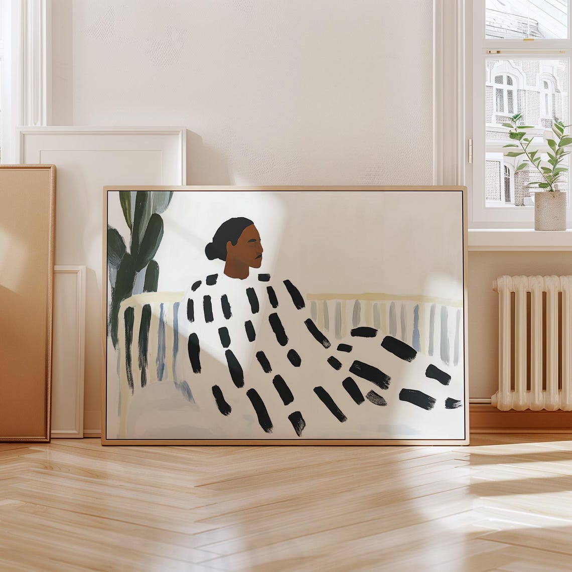 Woman in Bold Black Brushstroke Dress Beside Tall Cactus Poster