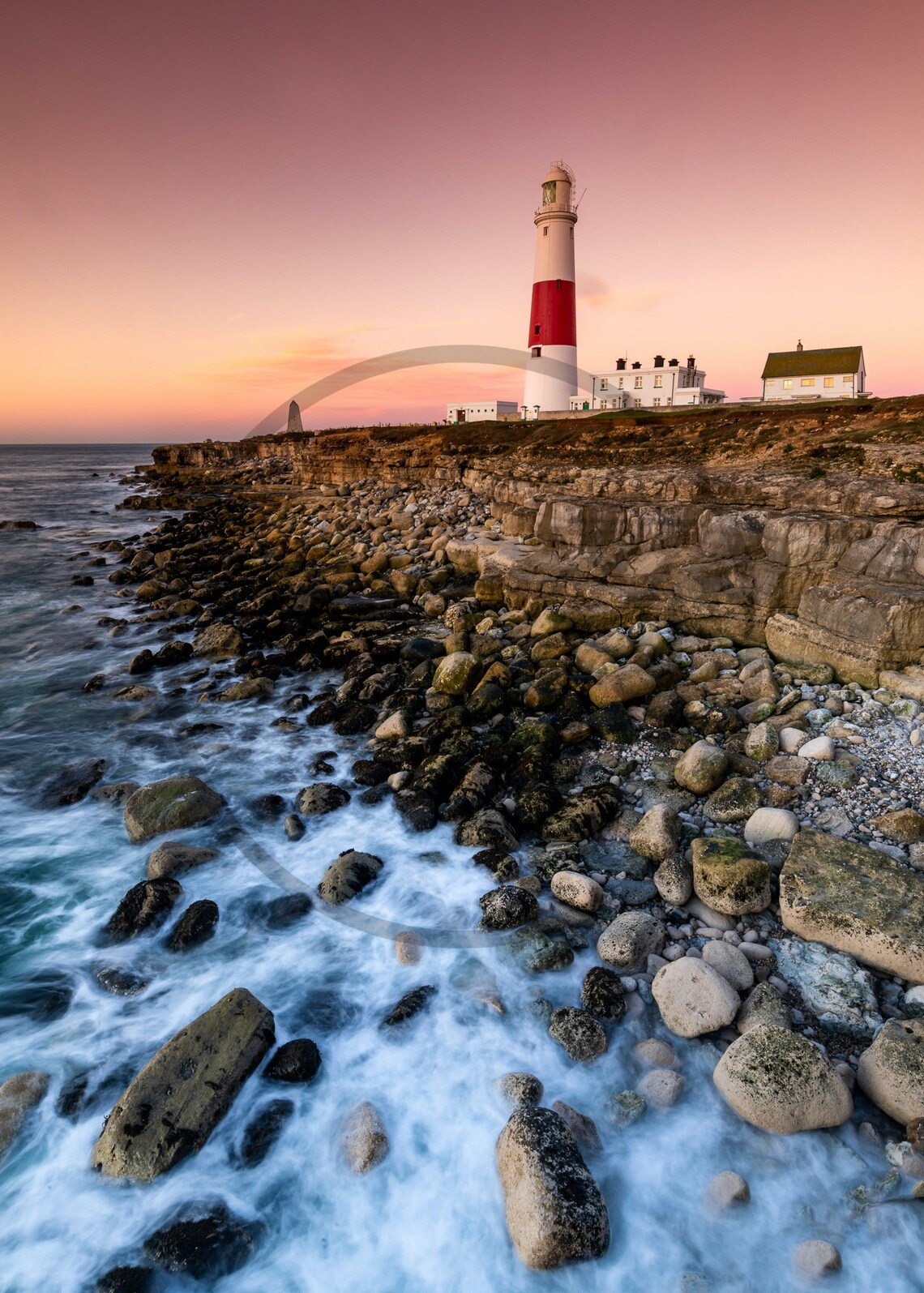 Red and White Striped Lighthouse on a Rocky Coast at Sunset Poster - Image 3