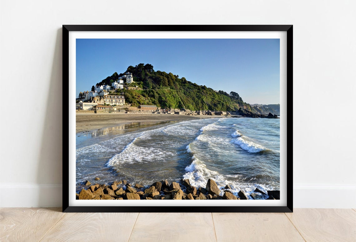 White Waves Breaking on Rocky Shores Below a Clifftop Village Poster