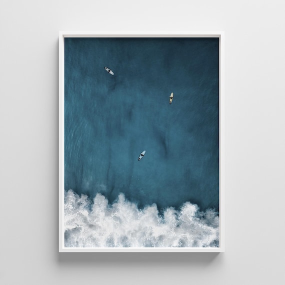 Aerial View of Three Surfers Over Turquoise Wave Photo Print