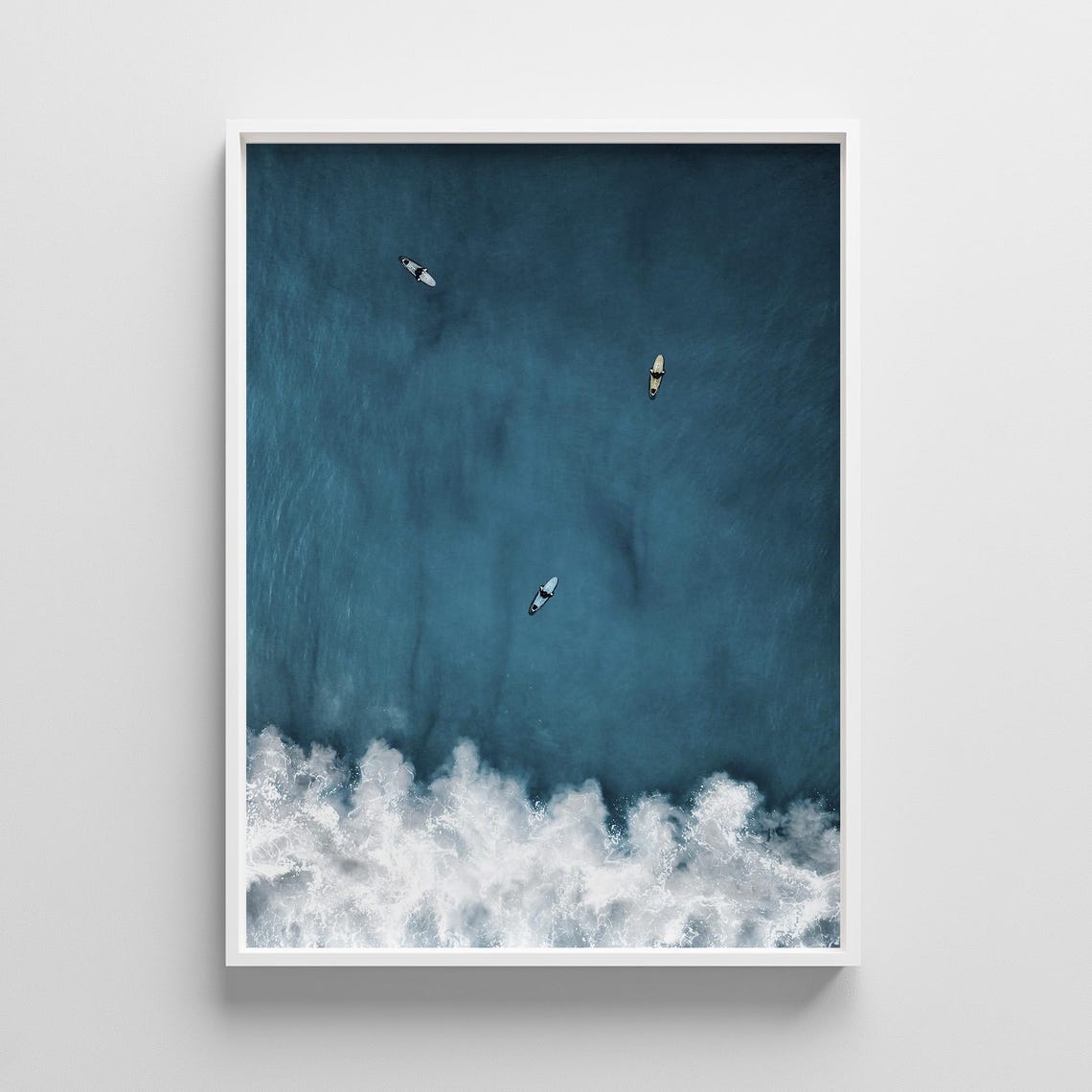 Aerial View of Three Surfers Over Turquoise Wave Photo Print