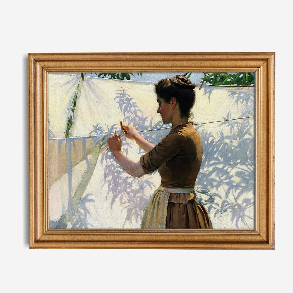 Woman Hanging Sunlit Laundry with Leaf Shadows Washday Scene Poster - Image 2