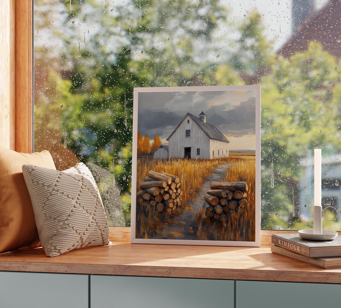 White Barn With Stacked Firewood in Golden Wheat Under Stormy Sky Wall Art - Image 2
