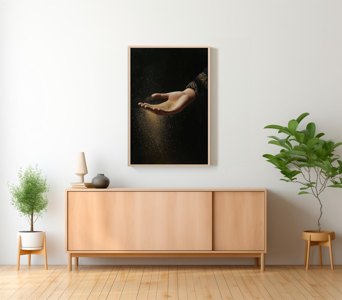 Hand Releasing Golden Stardust Against a Midnight Black Canvas Art Poster - Image 2