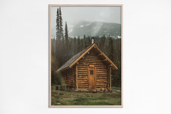 Rustic Log Cabin In Pine Forest Beneath Misty Mountains Print
