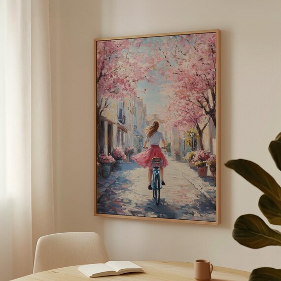 Springtime Serenity Woman Cycling Through A Cherry Blossom Lined Street With Vibrant Pink Blooms And A Tranquil Atmosphere