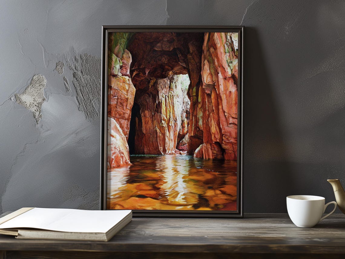 Red Rock Grotto with Sunlight Streaming Over Still Water Poster