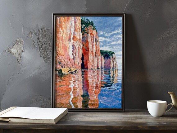 Orange Sea Cliffs with Dark Cave Reflection in Calm Water Poster